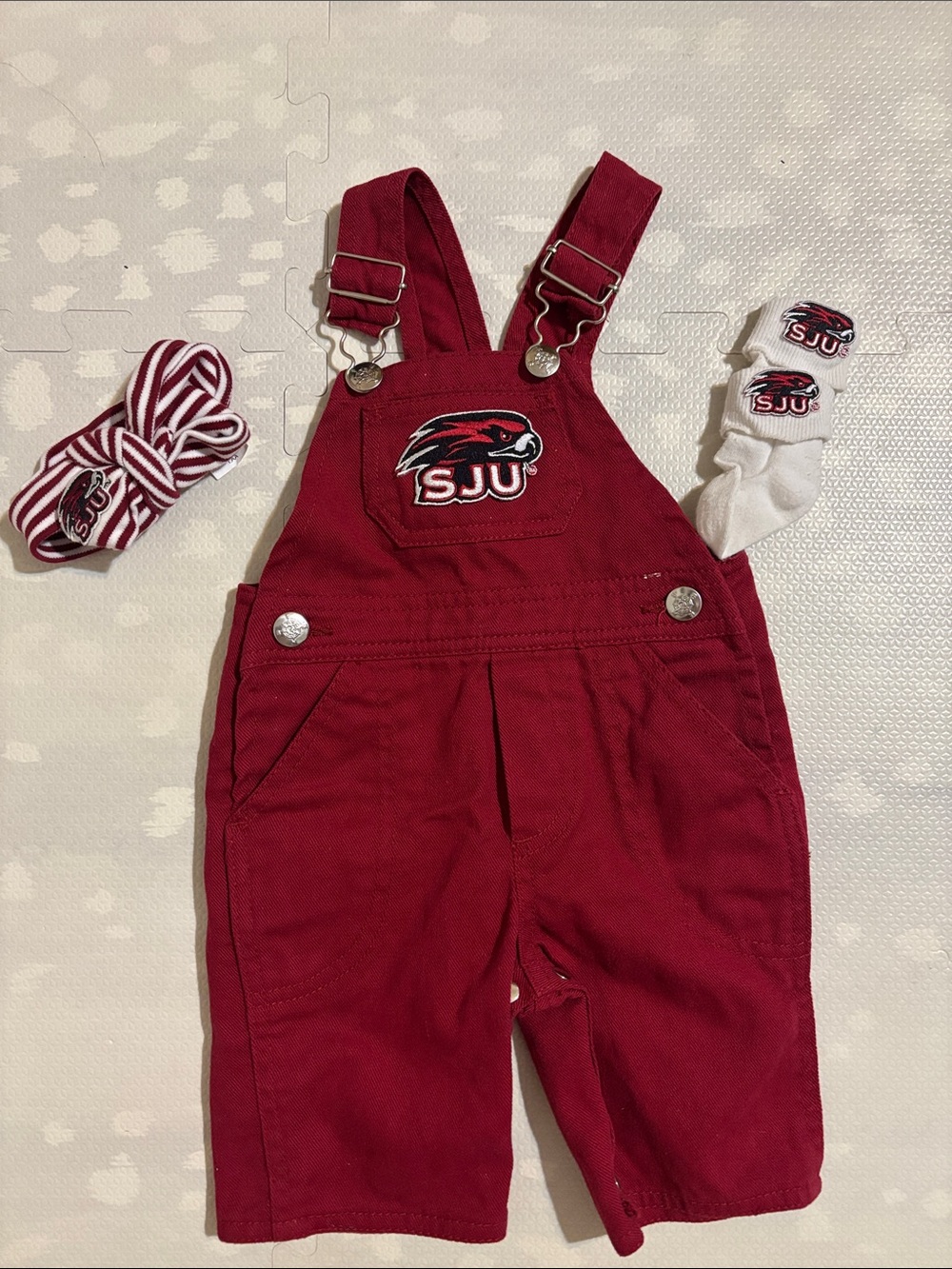 Creative Knitwear St. Joseph’s University Baby Overalls, Socks & Bow, 0–3 Mo.